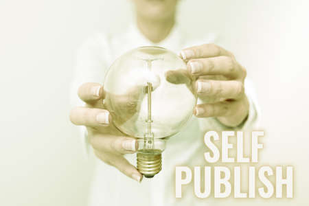 Hand writing sign Self Publish. Business approach writer publish piece of ones work independently at own expense Lady in outfit holding lamp with two hands presenting new technology ideasの写真素材