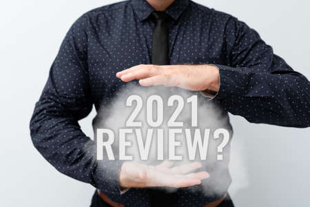 Conceptual caption 2021 Review Question. Word for remembering past year events main actions or good shows Presenting New Plans And Ideas Demonstrating Planning Processの写真素材