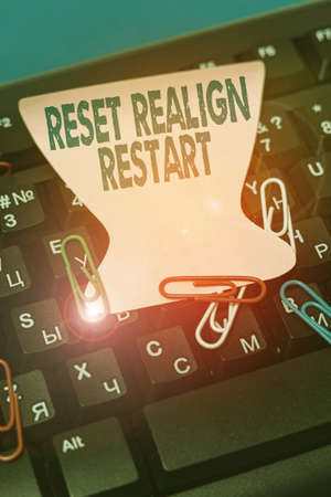 Text sign showing Reset Realign Restart. Word Written on Life audit will help you put things in perspectives Multiple Assorted Collection Office Stationery Photo Placed Over Tableの写真素材