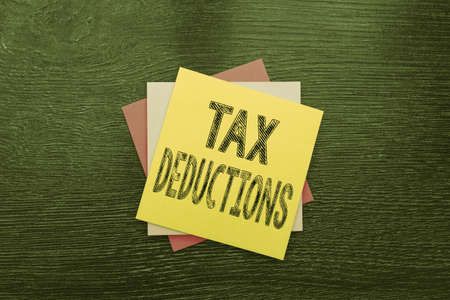 Writing displaying text Tax Deductions. Business idea reduction income that is able to be taxed of expenses New Ideas Fresh Concept Creative Communications Sticky Noteの写真素材