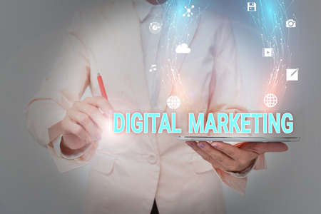 Inspiration showing sign Digital Marketing. Word for market products or services using technologies on Internet Business Woman Using Phone While Presenting New Futuristic Virtual Display.の写真素材