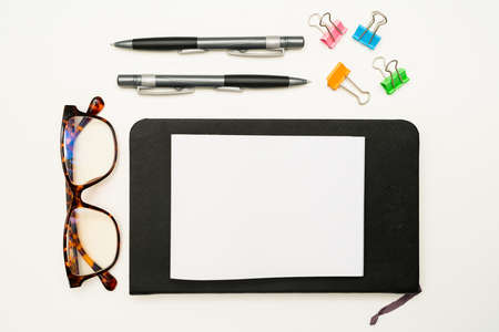 Office Supplies Over Desk With Keyboard And Glasses And Coffee Cup For Working Remotely, Assorted...