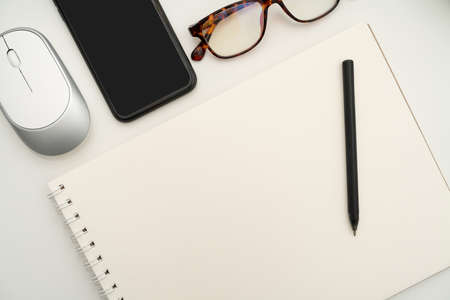 Office Supplies Over Desk With Keyboard And Glasses And Coffee Cup For Working Remotely, Assorted...