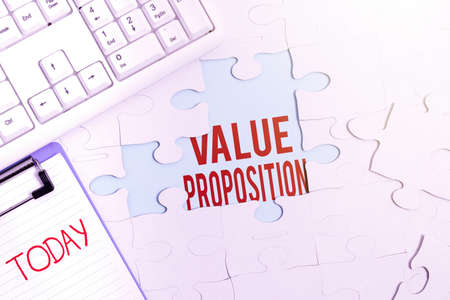Conceptual caption Value Proposition. Business idea innovation service intended make product attractive Building An Unfinished White Jigsaw Pattern Puzzle With Missing Last Pieceの写真素材