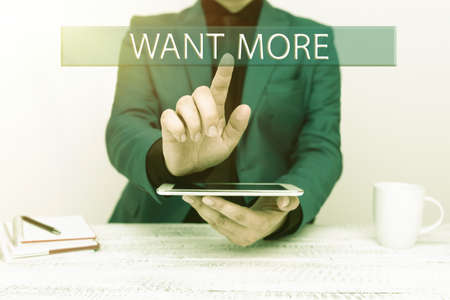 Hand writing sign Want More. Business approach Not having enough of something bigger challenges requirements Presenting Communication Technology Smartphone Voice And Video Callingの写真素材