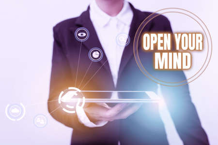 Conceptual display Open Your Mind. Business concept to be able to understand different ideas or ways of thinking Woman In Suit Standing Using Device Showing New Futuristic Virtual Tech.の写真素材