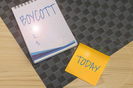 Conceptual display Boycott. Business concept stop buying or using the goods or services of a certain company Multiple Assorted Collection Office Stationery Photo Placed Over Tableの写真素材