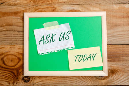 Hand writing sign Ask Us. Conceptual photo accepting questions or inquiry from showing Will answers any doubts Display of Different Color Sticker Notes Arranged On flatlay Lay Backgroundの写真素材