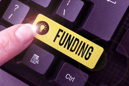 Text showing inspiration Funding. Word Written on money provided by an organization or government...