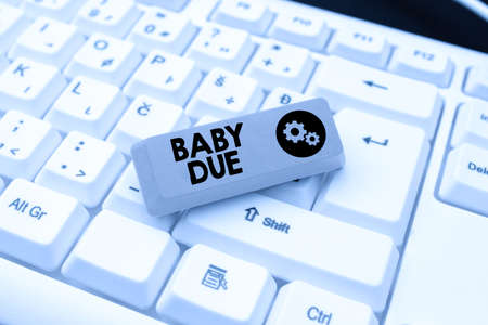 Hand writing sign Baby Due. Word for about to born Under engagement as to time Expected to be ready...