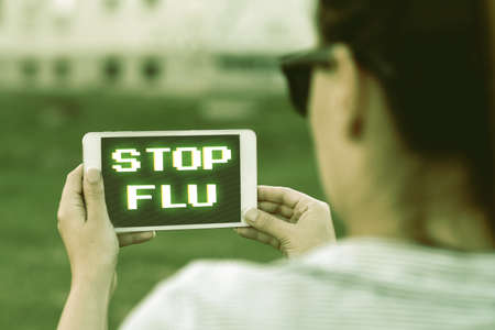 Text showing inspiration Stop Flu. Business concept Treat the contagious respiratory illness caused by influenza virus Voice And Video Calling Capabilities Connecting People Togetherの写真素材