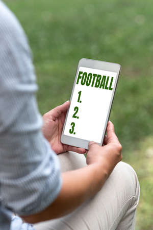 Handwriting text Football. Business concept any of various forms of team game involving kicking a ball Voice And Video Calling Capabilities Connecting People Togetherの写真素材