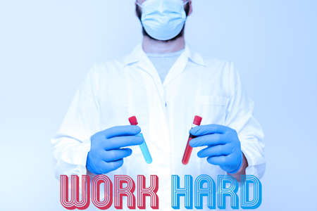 Inspiration showing sign Work Hard. Business overview Laboring that puts effort into doing and completing tasks Research Scientist Comparing Different Samples, Doctor Displaying Cureの写真素材