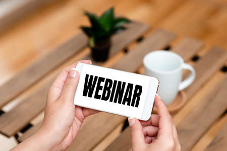 Sign displaying Webinar. Word for defined as seminar conducted over the Internet Web conferencing...