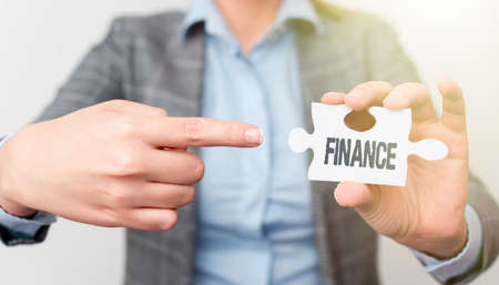 Sign displaying Finance. Business overview Management of large government companies money amount Provide funds Businesswoman Find Strategy For Resolving Missing Ideas At Officeの写真素材