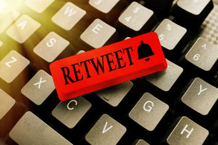 Hand writing sign Retweet. Word Written on in twitter repost or forward a message posted by another user Typing Image Descriptions And Keywords, Entering New Internet Websiteの写真素材