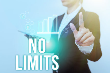 Sign displaying No Limits. Business concept to do whatever you could with out restrictions and holding back Woman In Suit Holding Tablet Showing Futuristic Interface Display.の写真素材