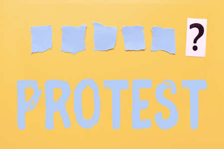 Writing displaying text Protest. Business idea An action expressing disapproval of or objection to...