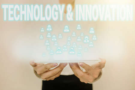 Text showing inspiration Technology And Innovation. Internet Concept Application of better Solution for New Market Need Lady In Uniform Standing Holding Tablet Showing Futuristic Technologies.の写真素材