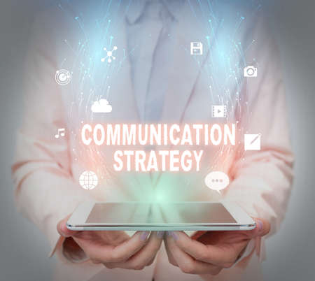 Text caption presenting Communication Strategy. Business idea Verbal Nonverbal or Visual Plans of Goal and Method Business Woman Using Phone While Presenting New Futuristic Virtual Display.の写真素材