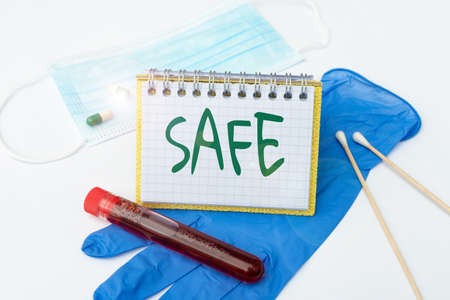 Text showing inspiration Safe. Concept meaning protected from or not exposed to danger or risk Not likely to be harmed Preparing And Writing Prescription Medicine, Preventing Virus Spreadの写真素材