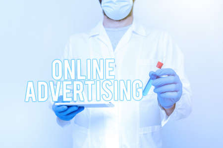 Hand writing sign Online Advertising. Business idea Internet Web Marketing to Promote Products and Services Researcher Displaying Liquid Sample, Chemist Presenting Cleaning Agentの写真素材