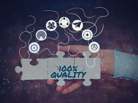 Text showing inspiration 100 Percent Quality. Business idea Guaranteed pure and no harmful chemicals Top Excellence Hand Holding Jigsaw Puzzle Piece Unlocking New Futuristic Technologies.の写真素材