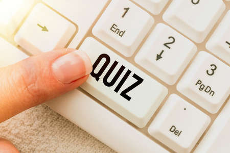 Hand writing sign Quiz. Business concept Brief informal test given to students Test of knowledge Examination Transcribing Online Voice Recordings, Typing And Recording Important Notesの写真素材
