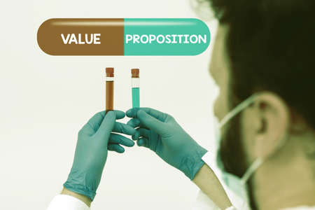 Writing displaying text Value Proposition. Business overview service make company or product attractive to customers Research Scientist Presenting New Medicine, Researching Preventive Measureの写真素材