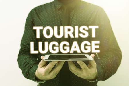 Hand writing sign Tourist Luggage. Business concept big bag that contains everything one needs for traveling Presenting New Technology Ideas Discussing Technological Improvementの写真素材