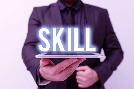 Hand writing sign Skill. Internet Concept ability to use one s is knowledge effectively and readily in execution Presenting New Technology Ideas Discussing Technological Improvementの写真素材