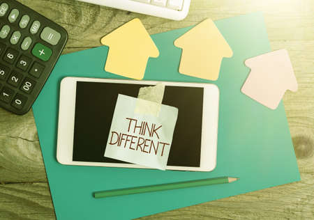 Handwriting text Think Different. Word Written on be unique with your thoughts or attitude Wind of change Display of Different Color Sticker Notes Arranged On flatlay Lay Backgroundの写真素材