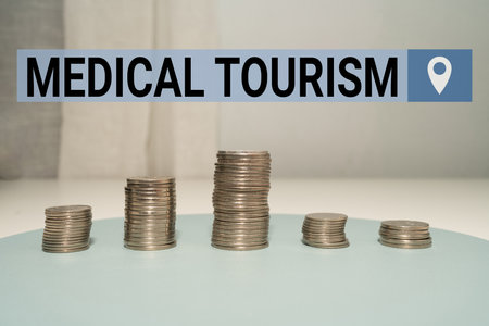 Handwriting text Medical Tourism. Conceptual photo traveling outside the country to receive medical care Coins Pile Over The Table Presenting Financial Plansの写真素材
