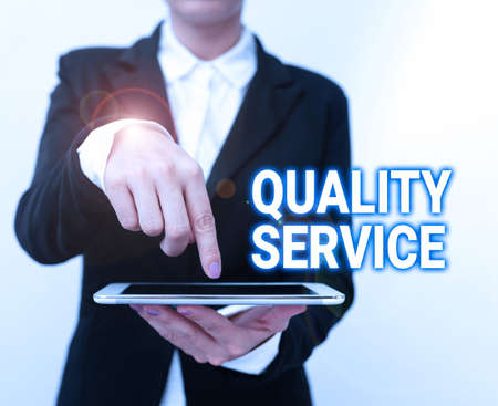 Hand writing sign Quality Service. Word Written on how well delivered service conforms to clientexpectations Presenting New Technology Ideas Discussing Technological Improvementの写真素材