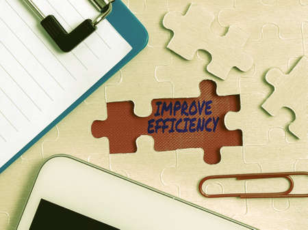 Handwriting text Improve Efficiency. Word Written on Competency in performance with Least Waste of...