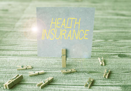 Hand writing sign Health Insurance, Word Written on coveragethat pays for medicaland surgical...