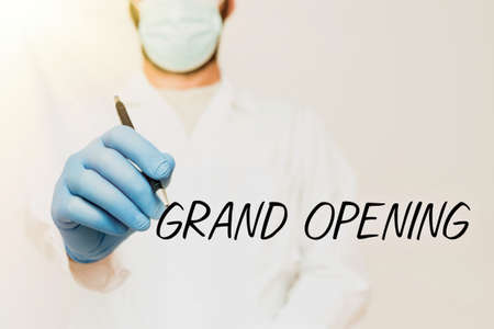 Hand writing sign Grand Opening. Business concept Ribbon Cutting New Business First Official Day...
