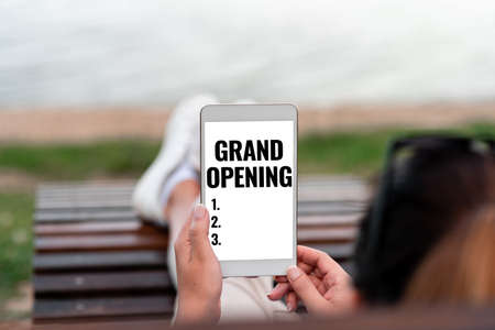 Text caption presenting Grand Opening. Word for Ribbon Cutting New Business First Official Day Launching Voice And Video Calling Capabilities Connecting People Togetherの写真素材