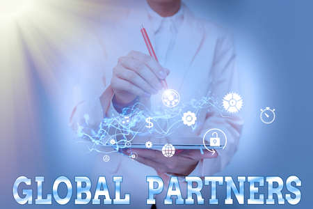 Text sign showing Global Partners. Business concept Two or more firms from different countries work as a team Lady In Suit Holding Phone And Performing Futuristic Image Presentation.の写真素材