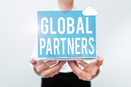 Sign displaying Global Partners. Business overview Two or more firms from different countries work as a team Presenting New Technology Ideas Discussing Technological Improvementの写真素材
