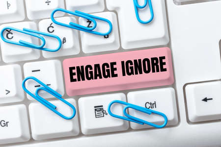 Text caption presenting Engage Ignore. Business idea Silent Treatment Manipulative Punishment Sulking Shunning Typing Firewall Program Codes, Typewriting Rules And Regulations Bookの写真素材