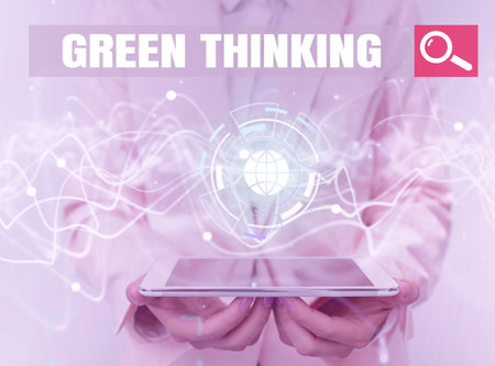 Text caption presenting Green Thinking. Concept meaning Taking ction to make environmental responsibility a reality Lady In Uniform Using Futuristic Mobile Holographic Display Screen.の写真素材