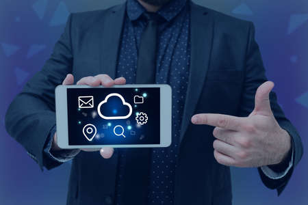 Man holding Screen Of Mobile Phone Showing The Futuristic Technology. Businessman Presenting Cell...