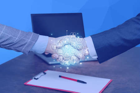 Hands Shaking Signing Contract Unlocking New Futuristic Technologies. Palm Holding Displaying Solving Late Innovative Virtual Ideas.の写真素材