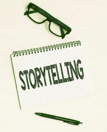 Text showing inspiration Storytelling. Business approach social and cultural Activity with Theatrical Gestures Flashy School Office Supplies, Teaching Learning Collections, Writing Tools,の写真素材