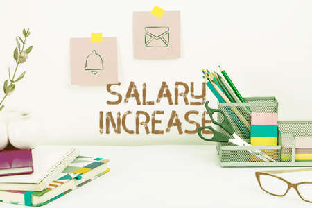 Text sign showing Salary Increase. Business overview an increase in the salary or pay given to an employee Tidy Workspace Setup, Writing Desk Tools Equipment, Smart Officeの写真素材