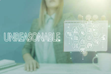 Text showing inspiration Unreasonable. Business concept Beyond the limits of acceptability or fairness Inappropriate Lady Pressing Screen Of Mobile Phone Showing The Futuristic Technologyの写真素材