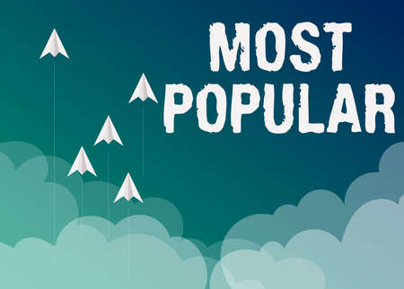 Inspiration showing sign Most Popular. Conceptual photo Liked Followed Enjoyed by majority of the showing in a society Five paper airplanes flying up sky surrounded with clouds achieving goals.の写真素材