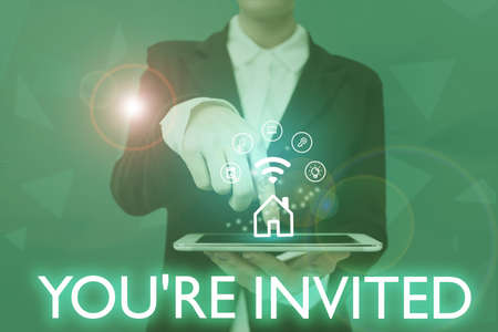 Writing displaying text You Re Invited. Business concept Please join us in our celebration Welcome Be a guest Lady Pressing Screen Of Mobile Phone Showing The Futuristic Technologyの写真素材