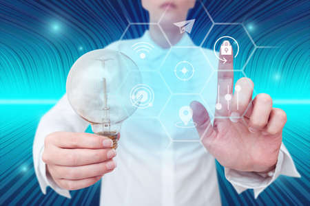 Lady holding light bulb pointing finger upwards symbolizing successful teamwork accomplishing newest...